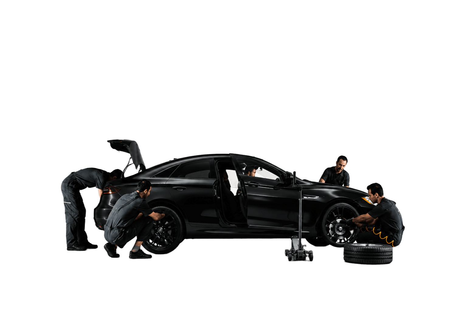 Professional mechanics servicing a luxury sports car